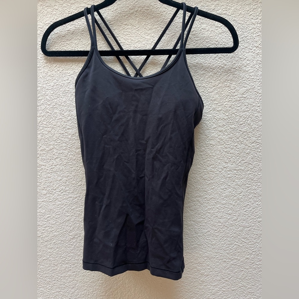 Lululemon black yoga tank.  Cross back. Flattering. Size 4.  Only worn once.